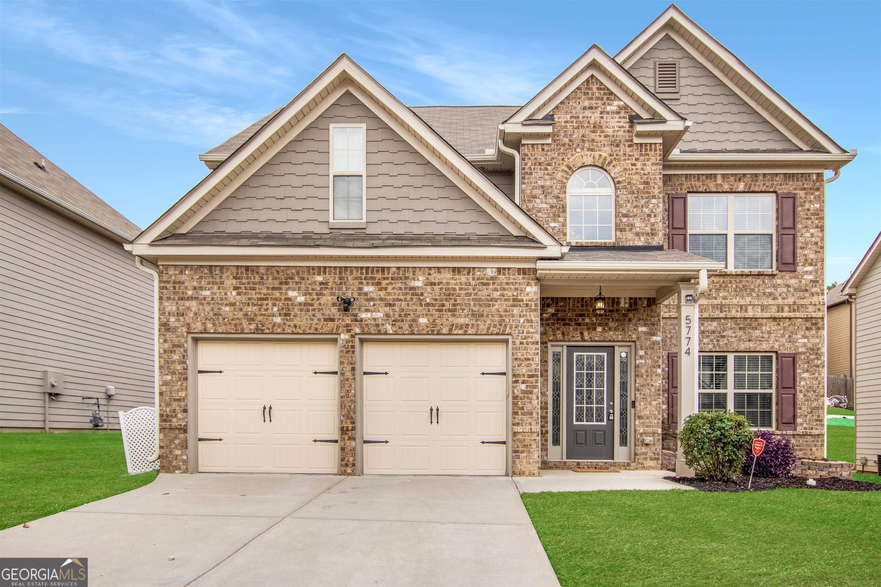 5774 Savannah River Road Atlanta, GA 30349 - Photo 1 of 1 a front view of a house with garden