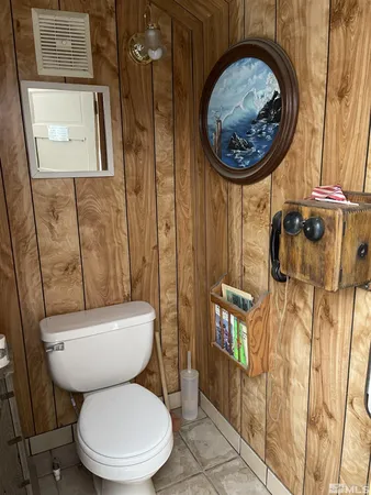 a bathroom with a toilet and a sink