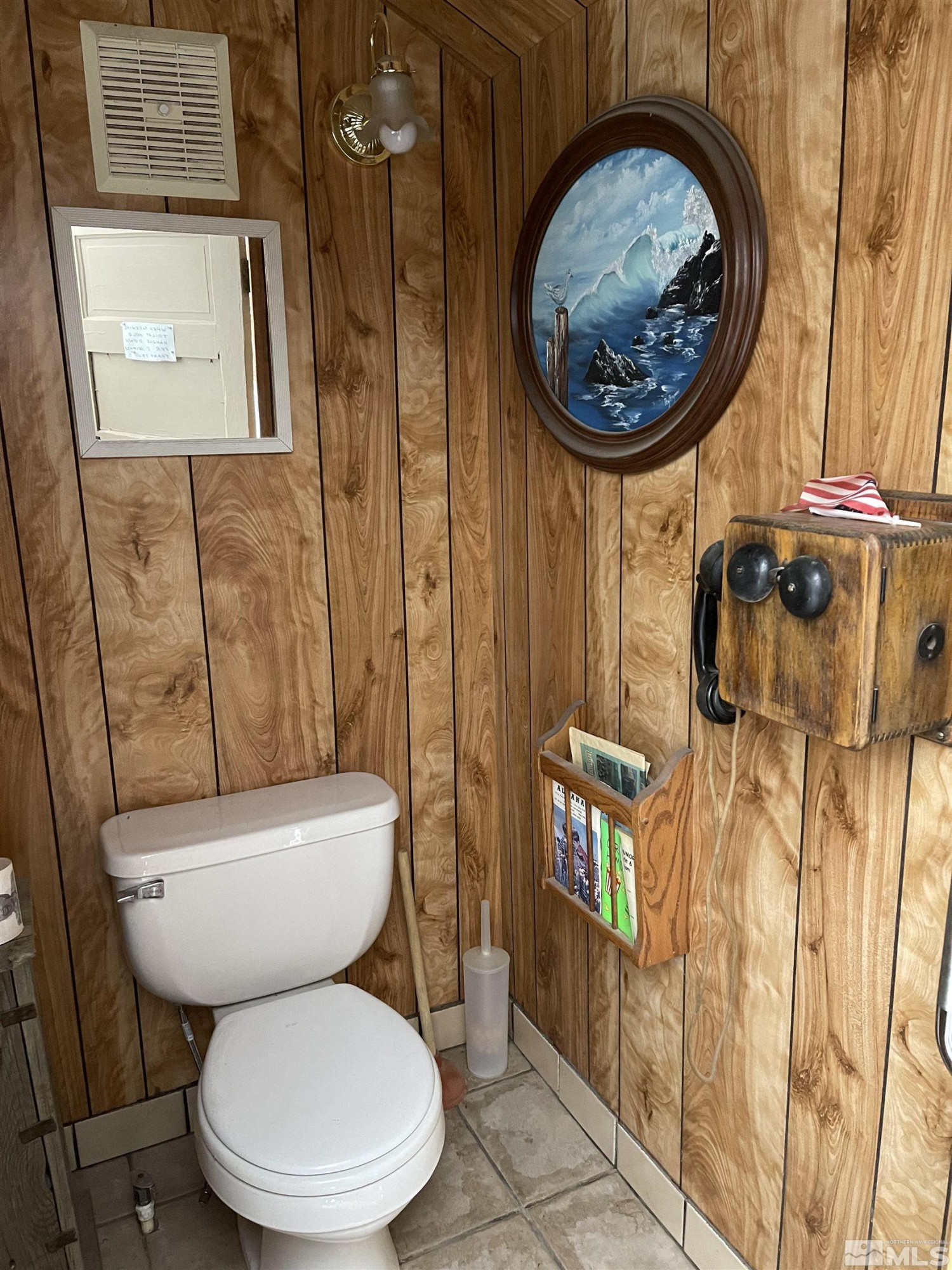 202 Main Street Jarbidge, NV 89826 - Photo 11 of 20 a bathroom with a toilet and a sink