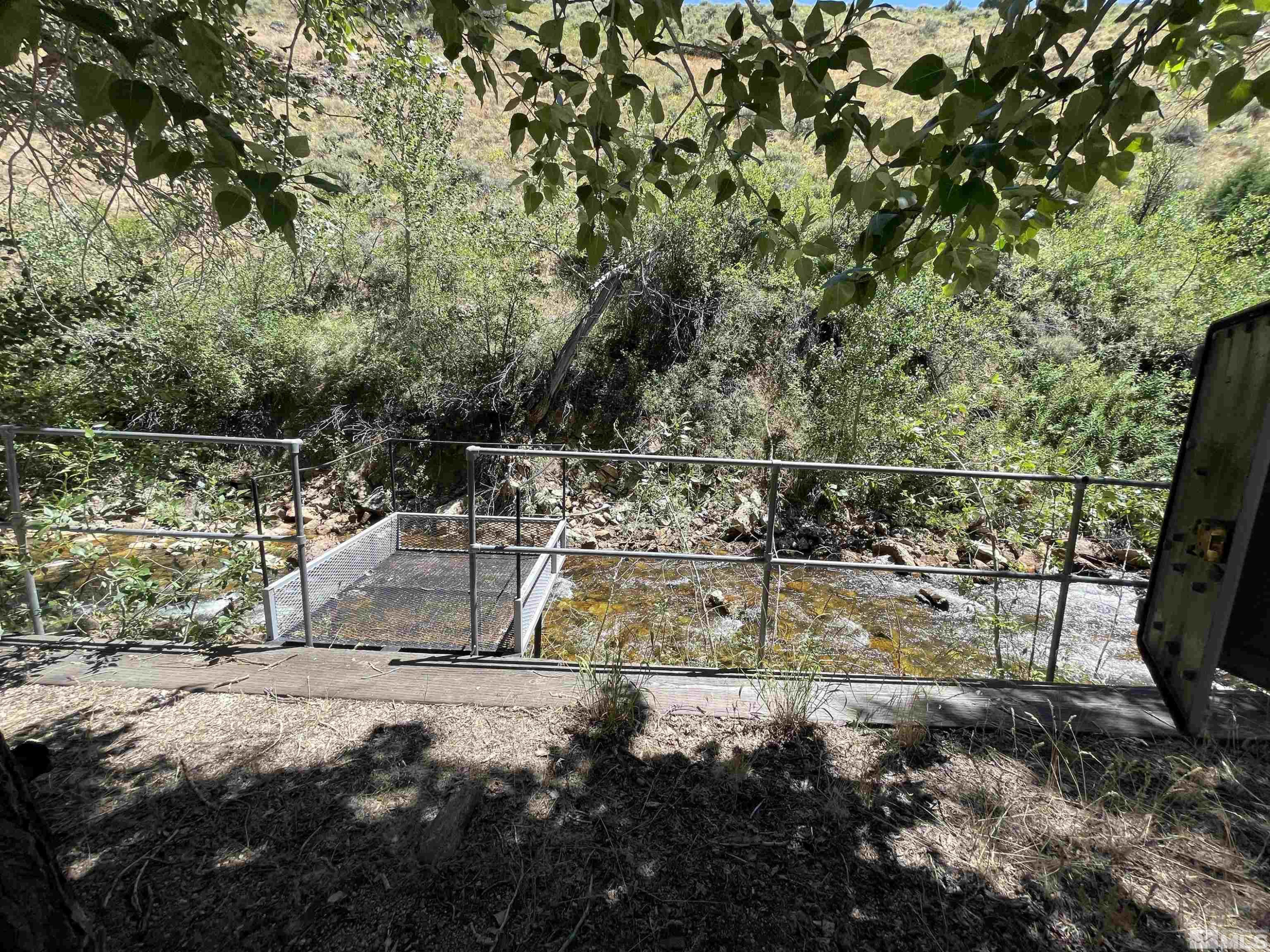 202 Main Street Jarbidge, NV 89826 - Photo 20 of 20 a view of a yard with table and chairs