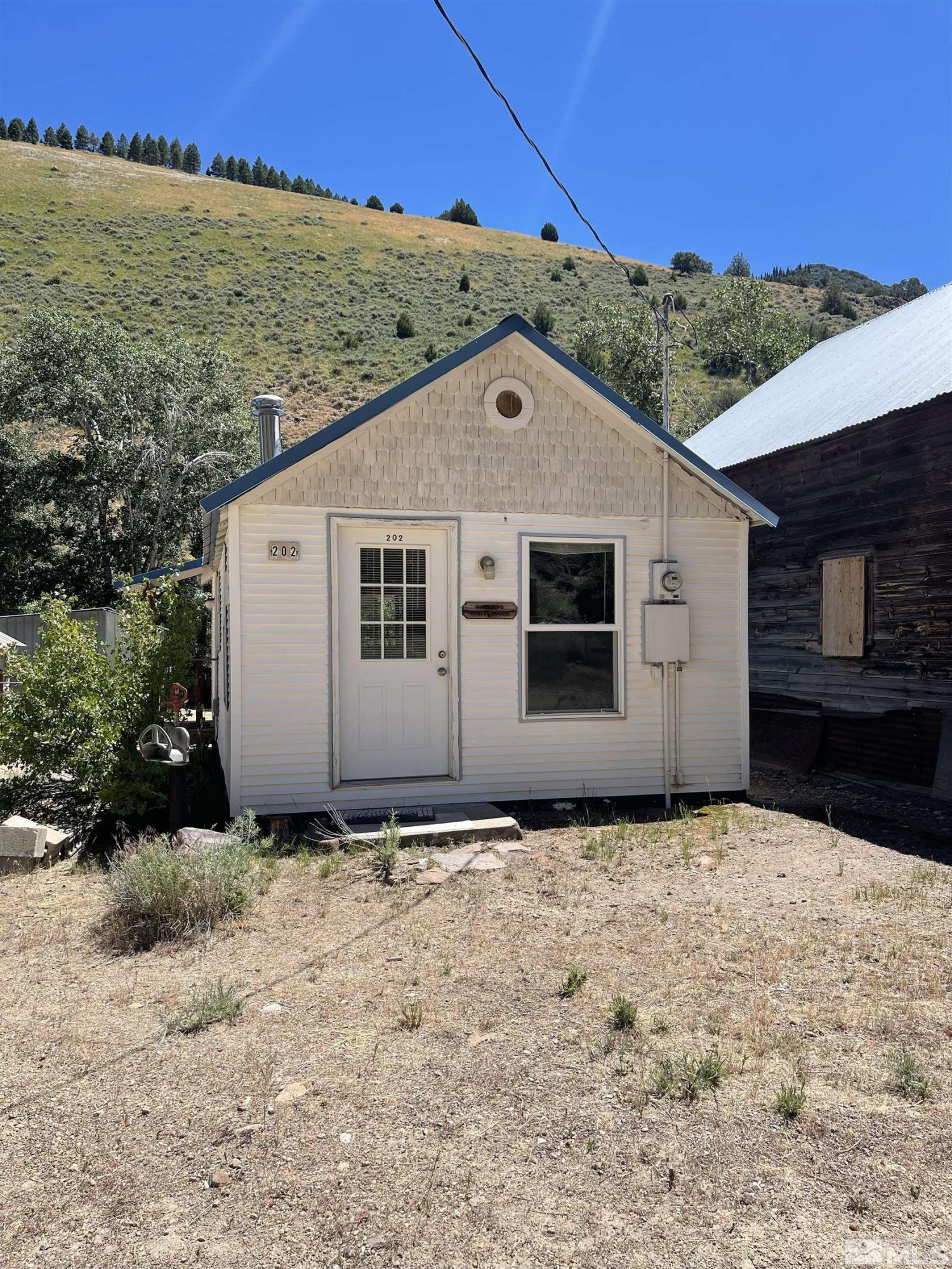 202 Main Street Jarbidge, NV 89826 - Photo 2 of 20 a backyard of a house