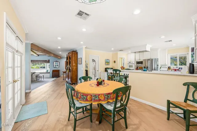 a dining room with furniture and window