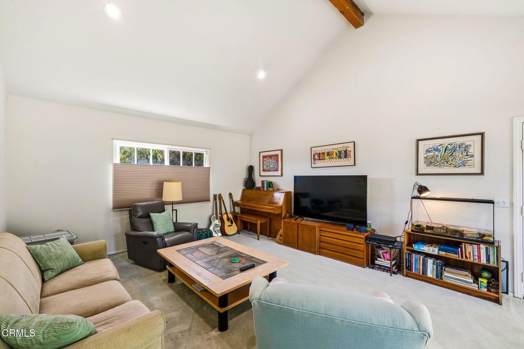 17933 Osborne Street Northridge, CA 91325 - Photo 15 of 33 a living room with furniture and a flat screen tv
