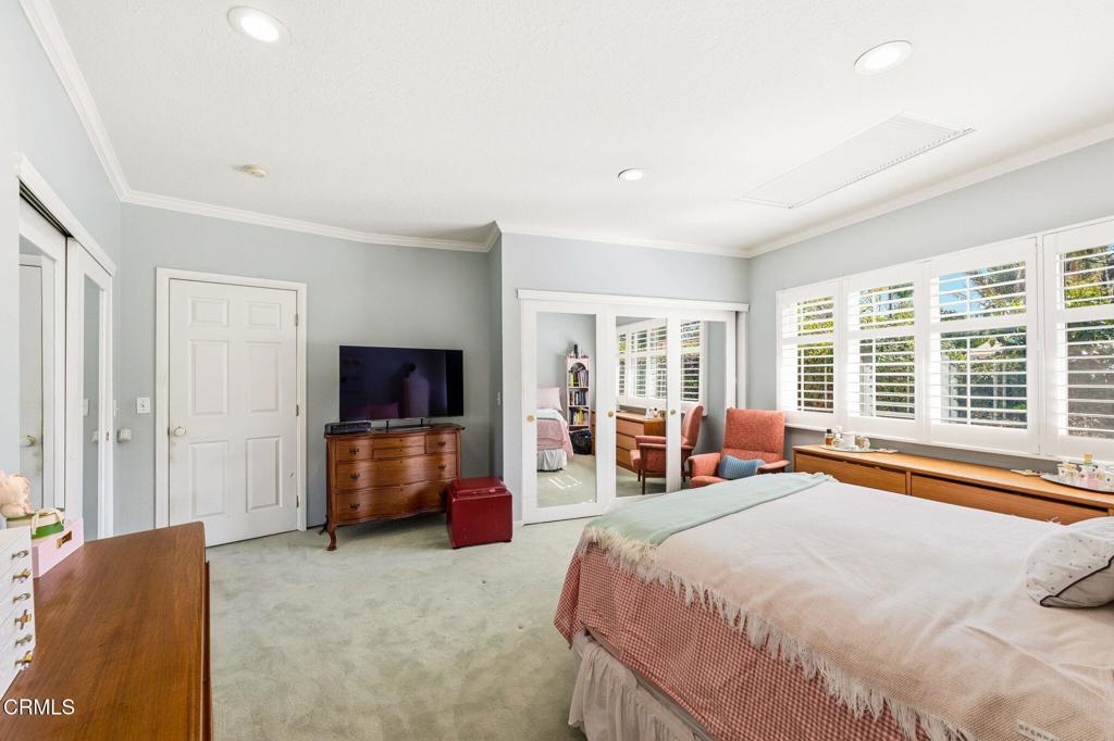 17933 Osborne Street Northridge, CA 91325 - Photo 19 of 33 a bedroom with furniture and flat screen tv