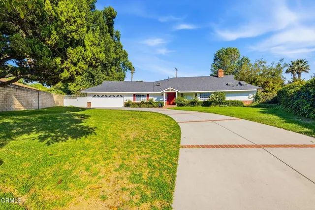 a view of swimming pool with outdoor seating and green space