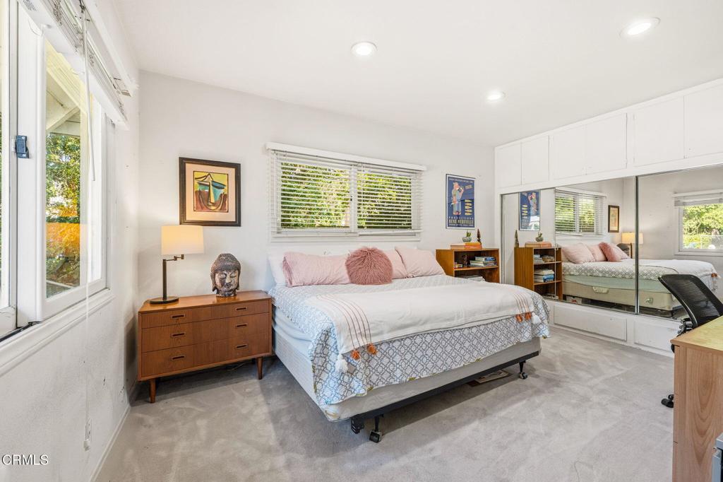 17933 Osborne Street Northridge, CA 91325 - Photo 24 of 33 a bedroom with a bed and dresser with window