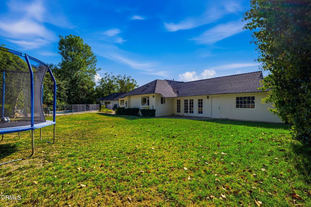 17933 Osborne Street Northridge, CA 91325 - Photo 32 of 33 a view of a house with a yard