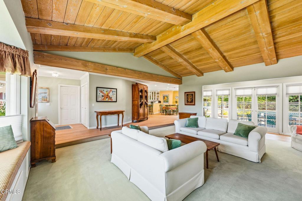 17933 Osborne Street Northridge, CA 91325 - Photo 5 of 33 a living room with furniture and a floor to ceiling window