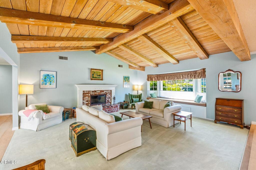 17933 Osborne Street Northridge, CA 91325 - Photo 6 of 33 a living room with furniture and a fireplace