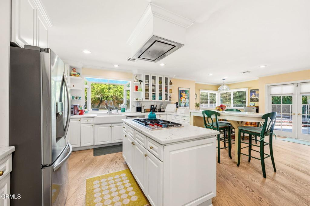 17933 Osborne Street Northridge, CA 91325 - Photo 8 of 33 a kitchen that has a cabinets and a stove