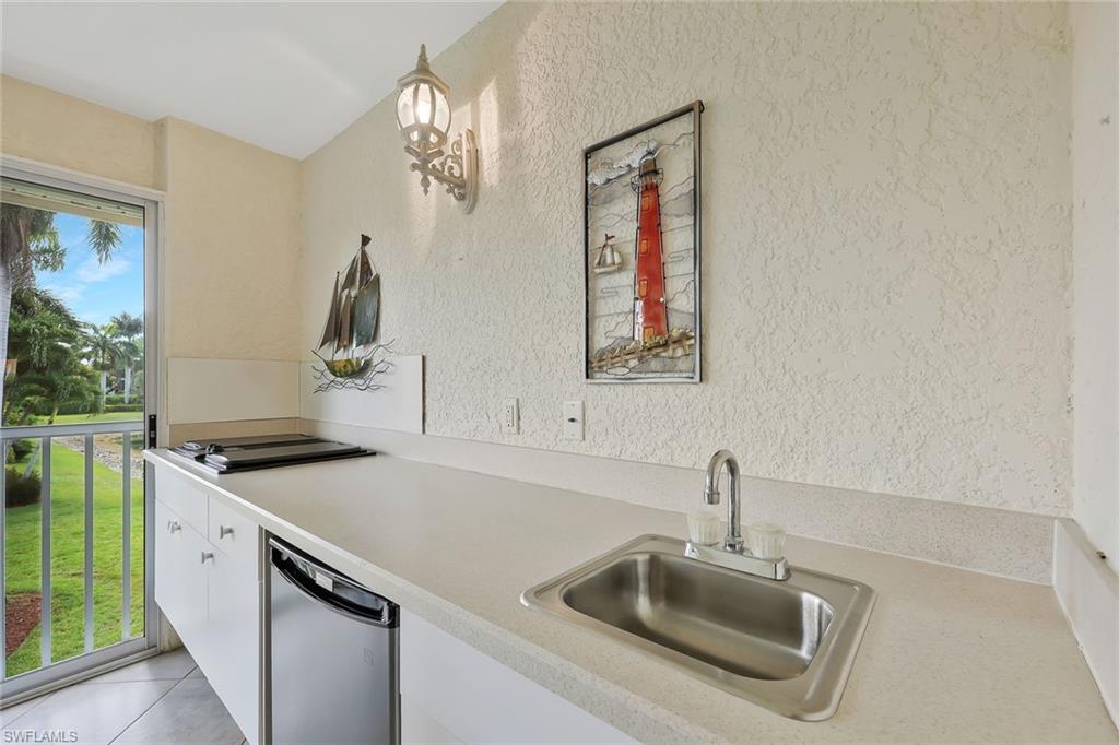 2395 Bayou Lane, Unit 7304 Naples, FL 34112 - Photo 23 of 27 LANAI SUMMER KITCHEN WITH ELECTRIC GRILL