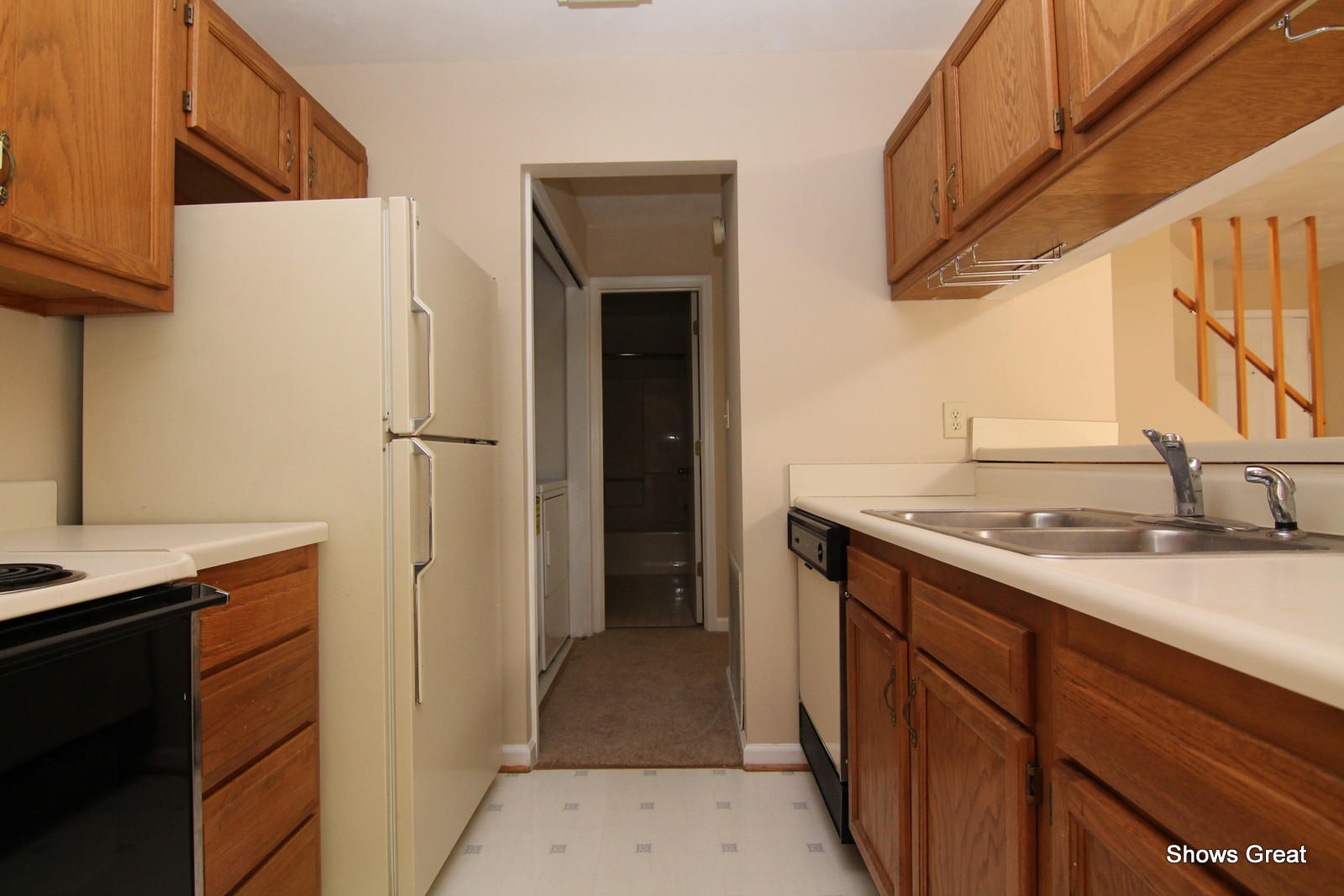 3267 Forest Ridge Road, Unit D Roanoke, VA 24018 - Photo 11 of 28 a kitchen with a sink and a refrigerator