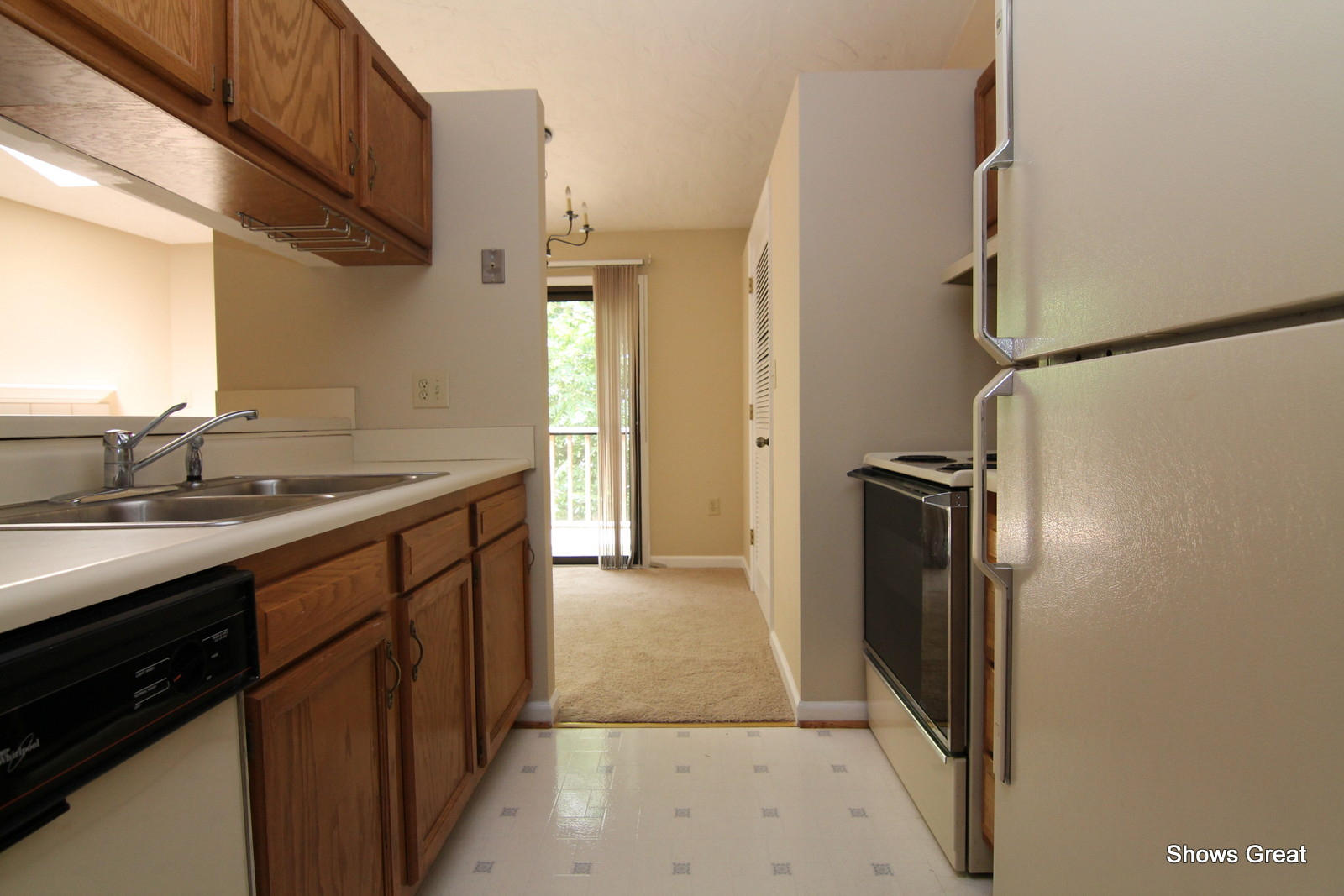 3267 Forest Ridge Road, Unit D Roanoke, VA 24018 - Photo 12 of 28 a kitchen with stainless steel appliances granite countertop a sink stove and refrigerator