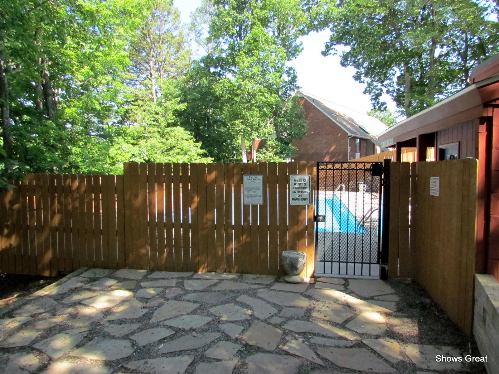 3267 Forest Ridge Road, Unit D Roanoke, VA 24018 - Photo 26 of 28 a backyard of a house with lawn chairs and wooden fence