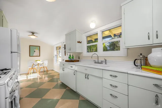 a kitchen with sink and window
