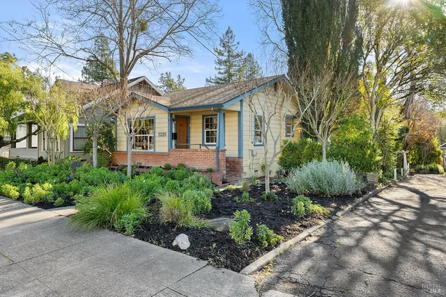 a front view of a house with garden