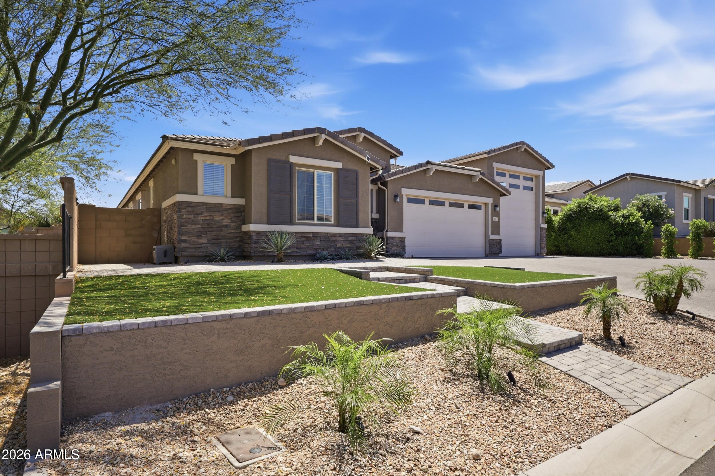 12517 West Lawrence Road Glendale, AZ 85307 - Photo 5 of 52 a front view of a house with a yard