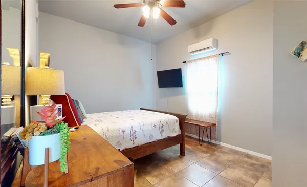 a bed room with a bed and a chandelier