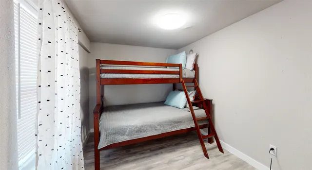 a room with window and ceiling fan