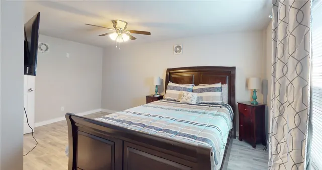 a bathroom with a shower curtain and a bathtub