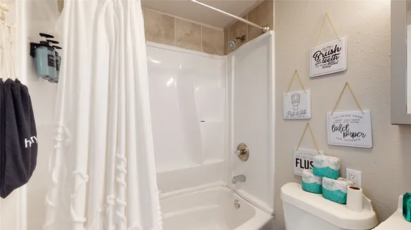 a backyard of a house with outdoor seating