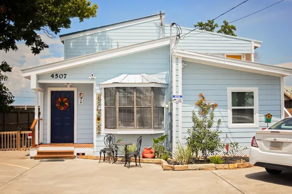 a front view of a house with a porch