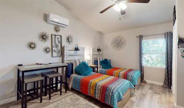 a bedroom with a bed and a table in it