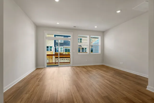 a view of kitchen with wooden floor and window