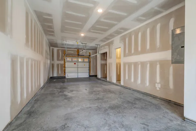 a view of building with door and a yard