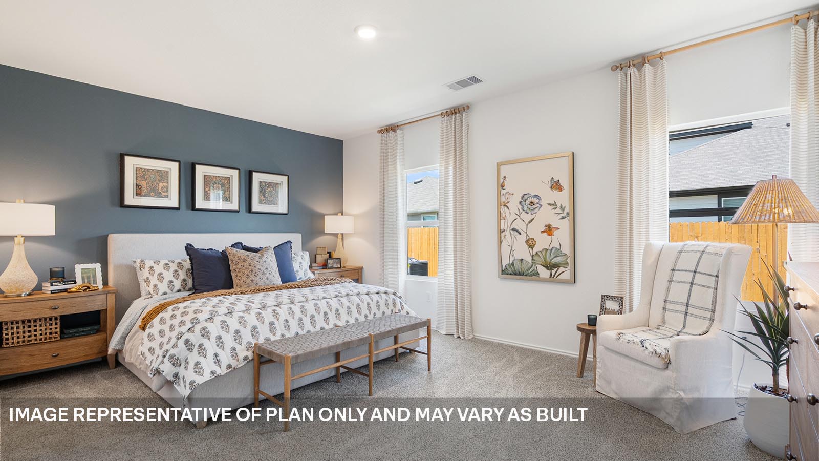 174 Balmorhea Street Kyle, TX 78640 - Photo 12 of 27 a bedroom with a bed and a couch