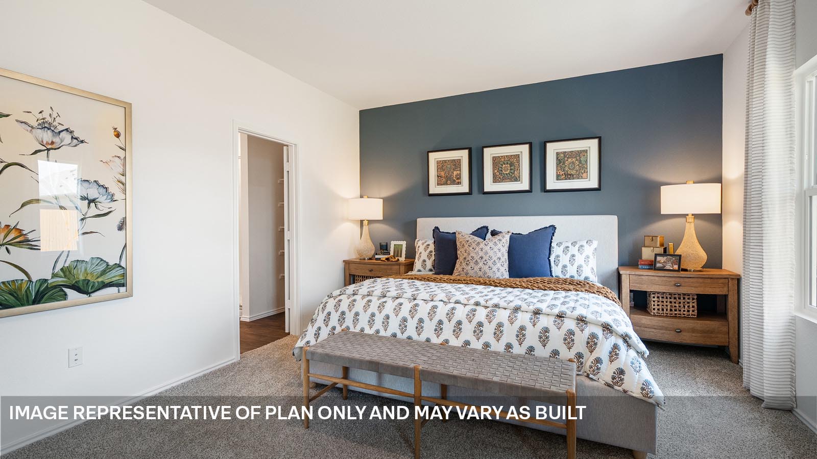 174 Balmorhea Street Kyle, TX 78640 - Photo 13 of 27 a bedroom with a bed and a painting on the wall