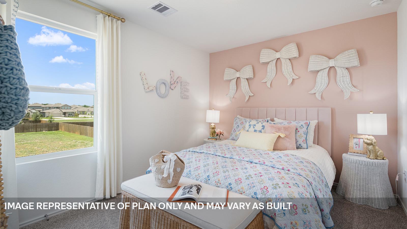 174 Balmorhea Street Kyle, TX 78640 - Photo 23 of 27 a bedroom with a bed and window