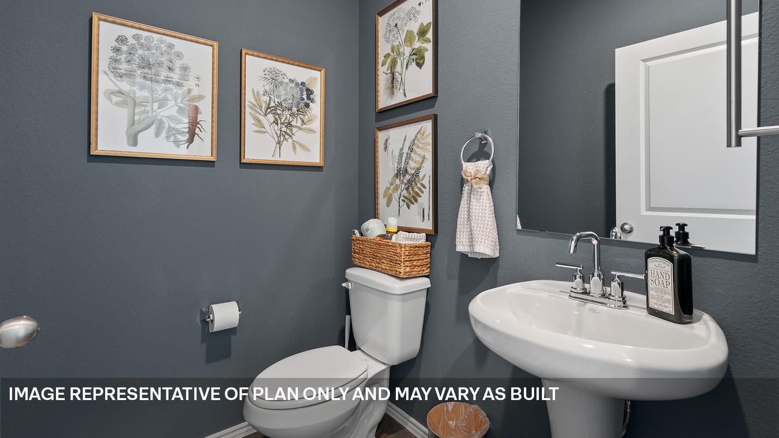 174 Balmorhea Street Kyle, TX 78640 - Photo 26 of 27 a bathroom with a toilet a sink and a mirror