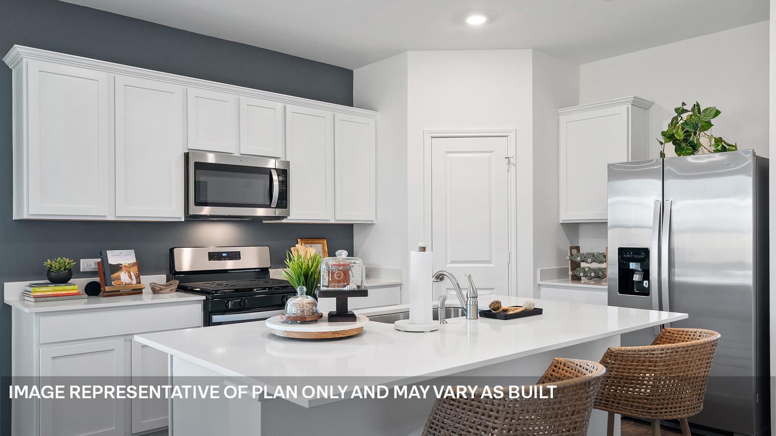 174 Balmorhea Street Kyle, TX 78640 - Photo 6 of 27 a kitchen with stainless steel appliances granite countertop a sink a stove a refrigerator and cabinets