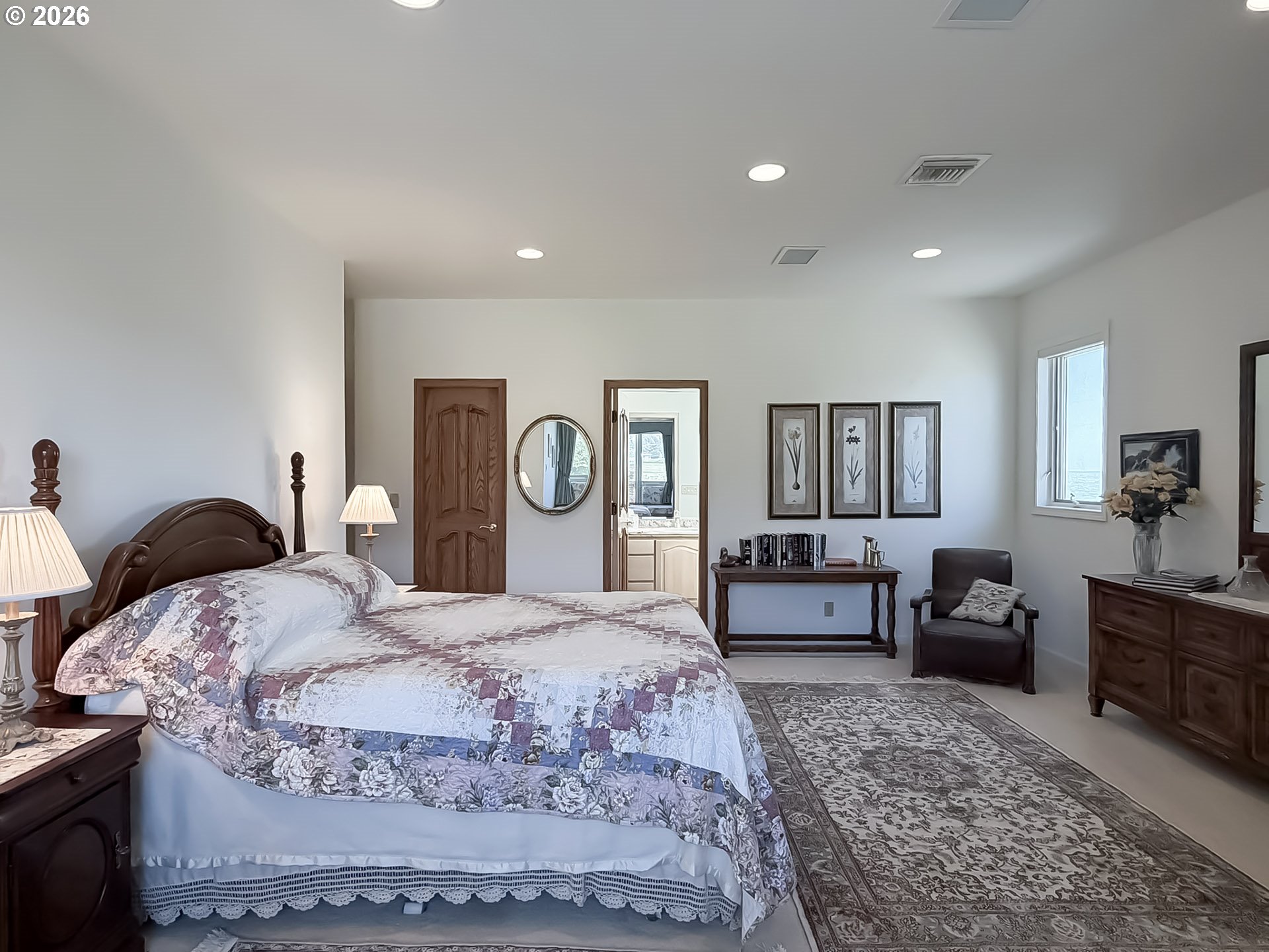 98696 Fox Drive Brookings, OR 97415 - Photo 33 of 48 a bedroom with a large bed and wooden floor