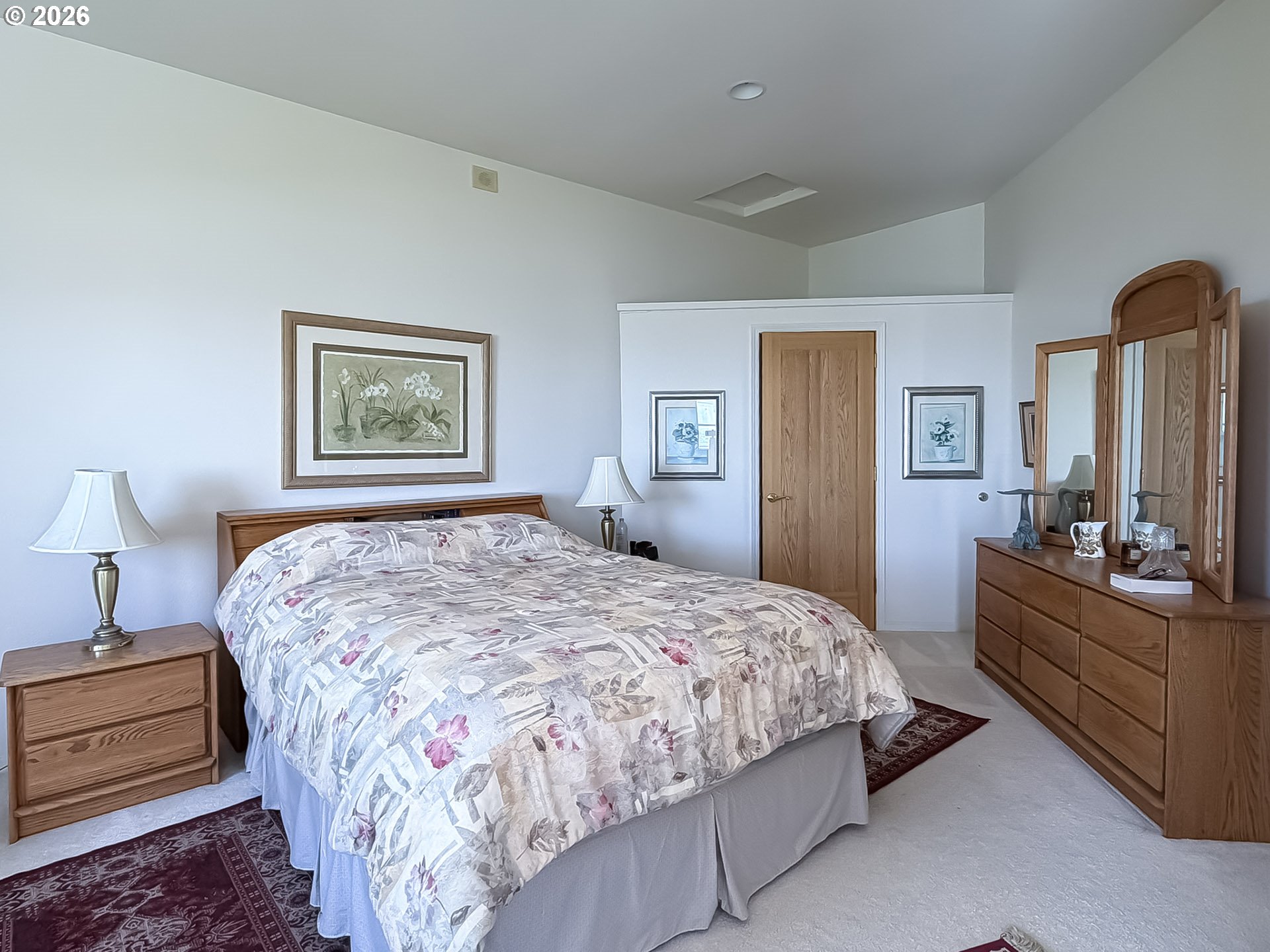 98696 Fox Drive Brookings, OR 97415 - Photo 34 of 48 a bedroom with a bed and a dresser