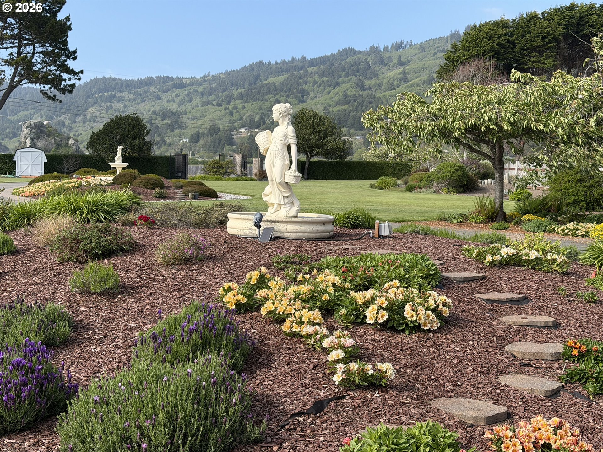 98696 Fox Drive Brookings, OR 97415 - Photo 44 of 48 a view of a garden with a mountain