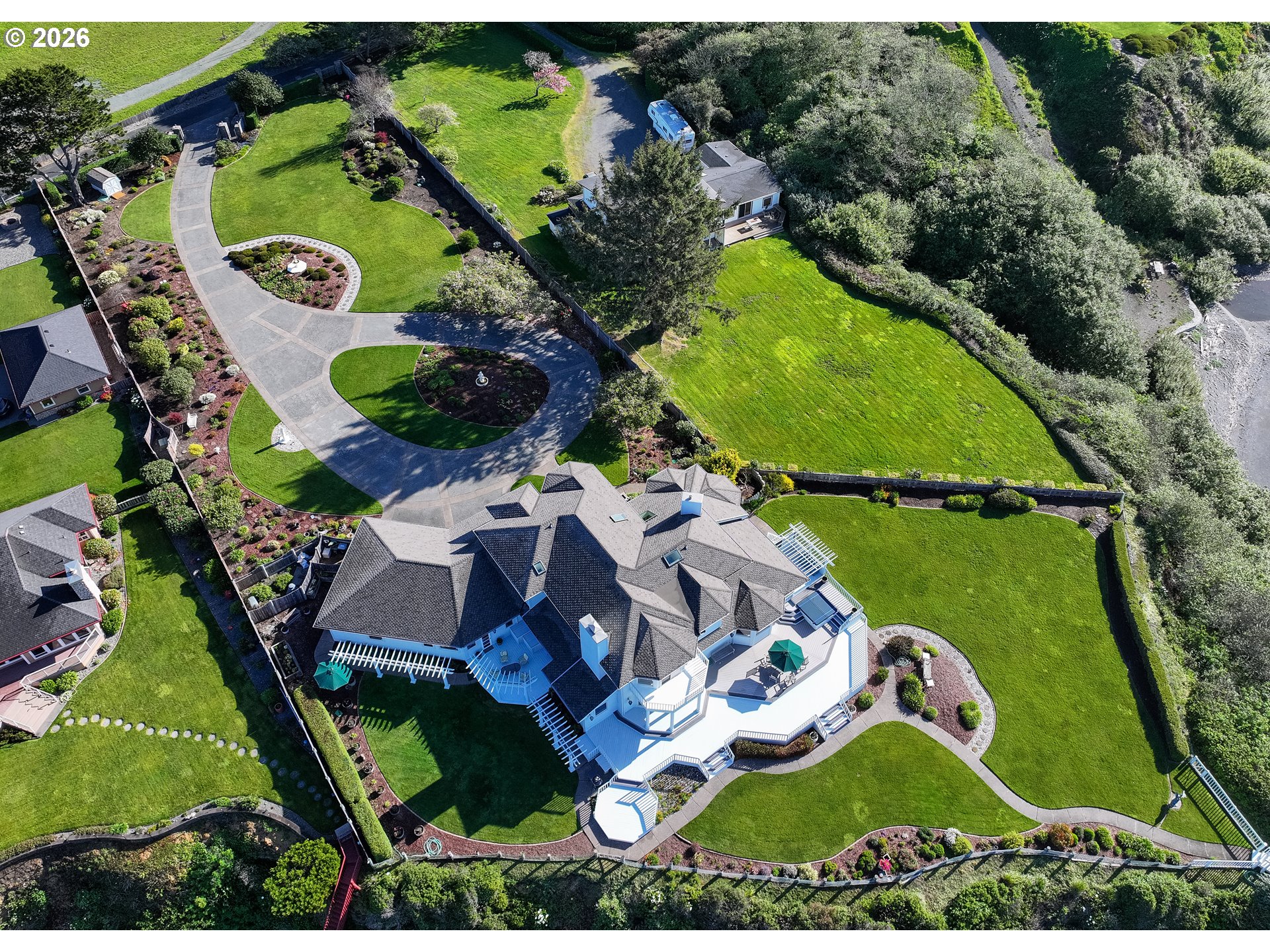98696 Fox Drive Brookings, OR 97415 - Photo 46 of 48 an aerial view of a house with a garden and trees