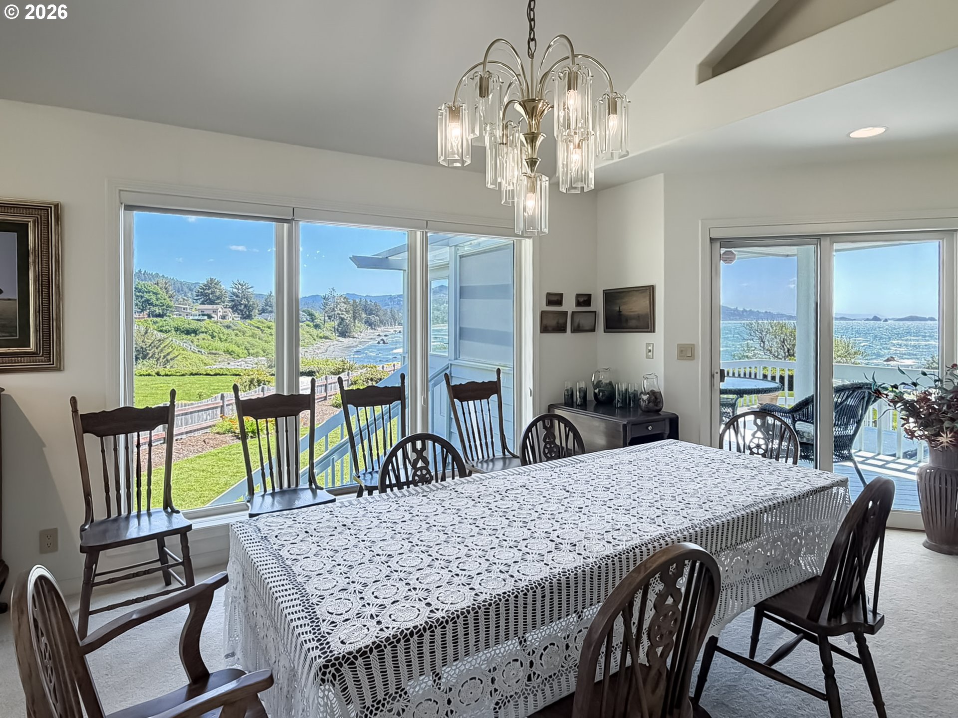 98696 Fox Drive Brookings, OR 97415 - Photo 6 of 48 a view of a dining room with furniture a livingroom and chandelier