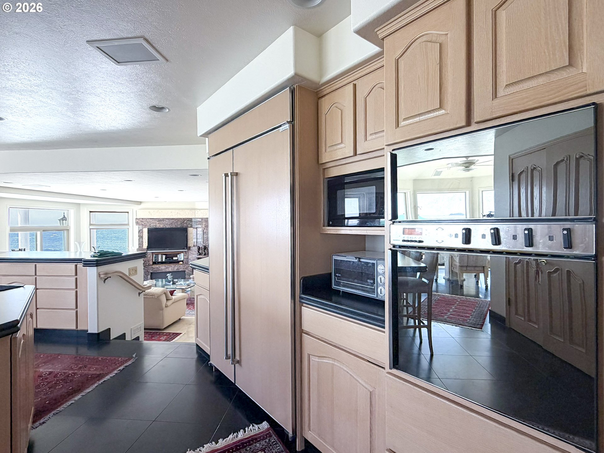 98696 Fox Drive Brookings, OR 97415 - Photo 8 of 48 a kitchen with stainless steel appliances granite countertop a refrigerator and microwave