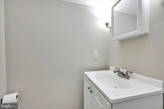 a bathroom with a sink and mirror