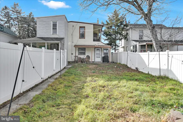a view of house with yard