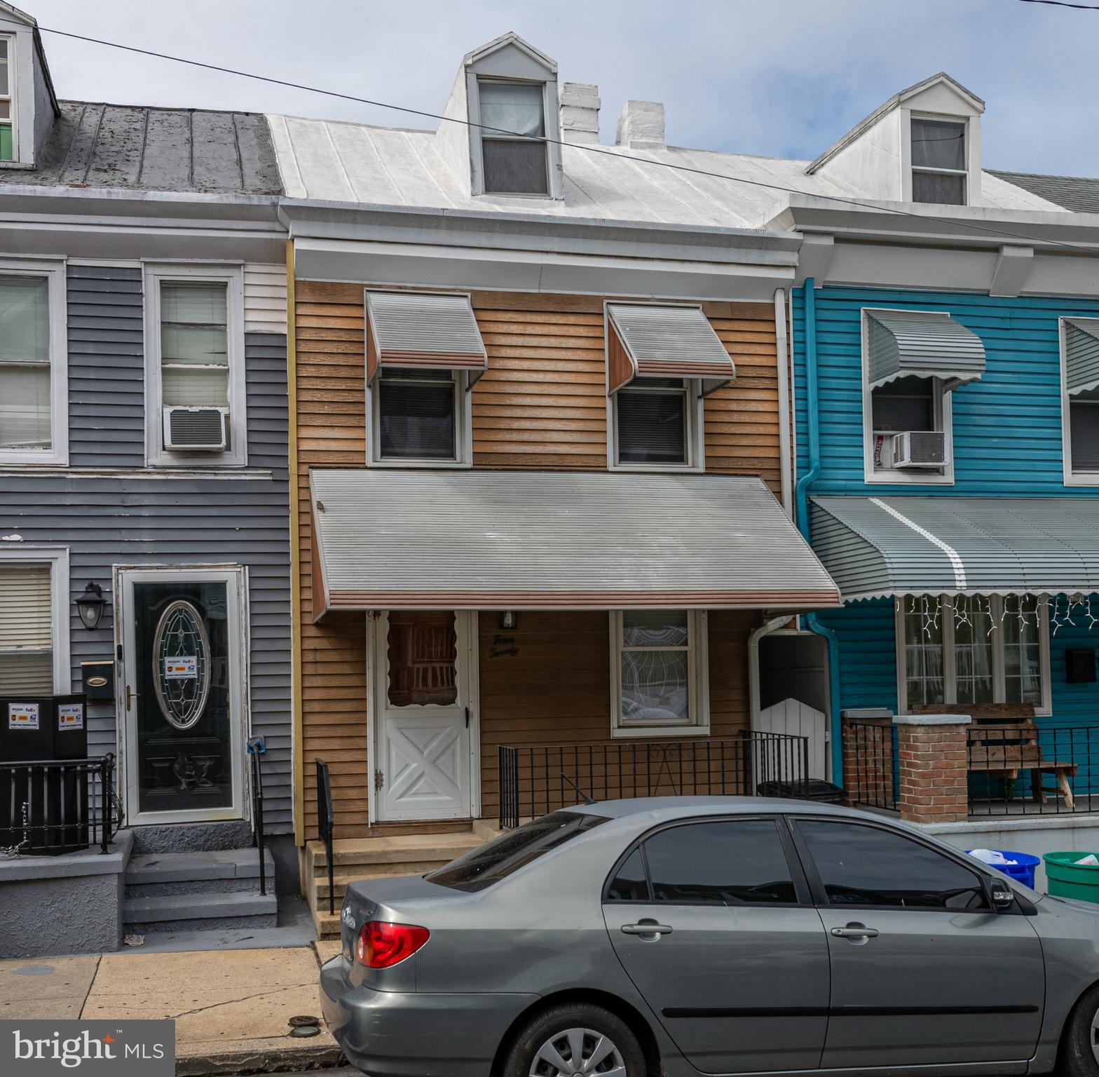 a view of a car parked in front of a building