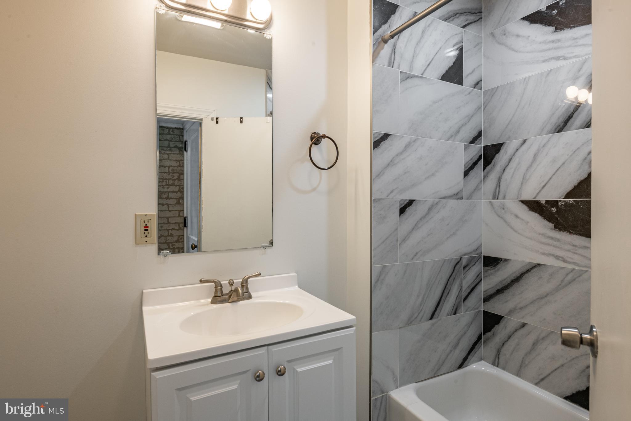 420 North 11th Street Reading, PA 19604 - Photo 12 of 20 a bathroom with a sink toilet and shower