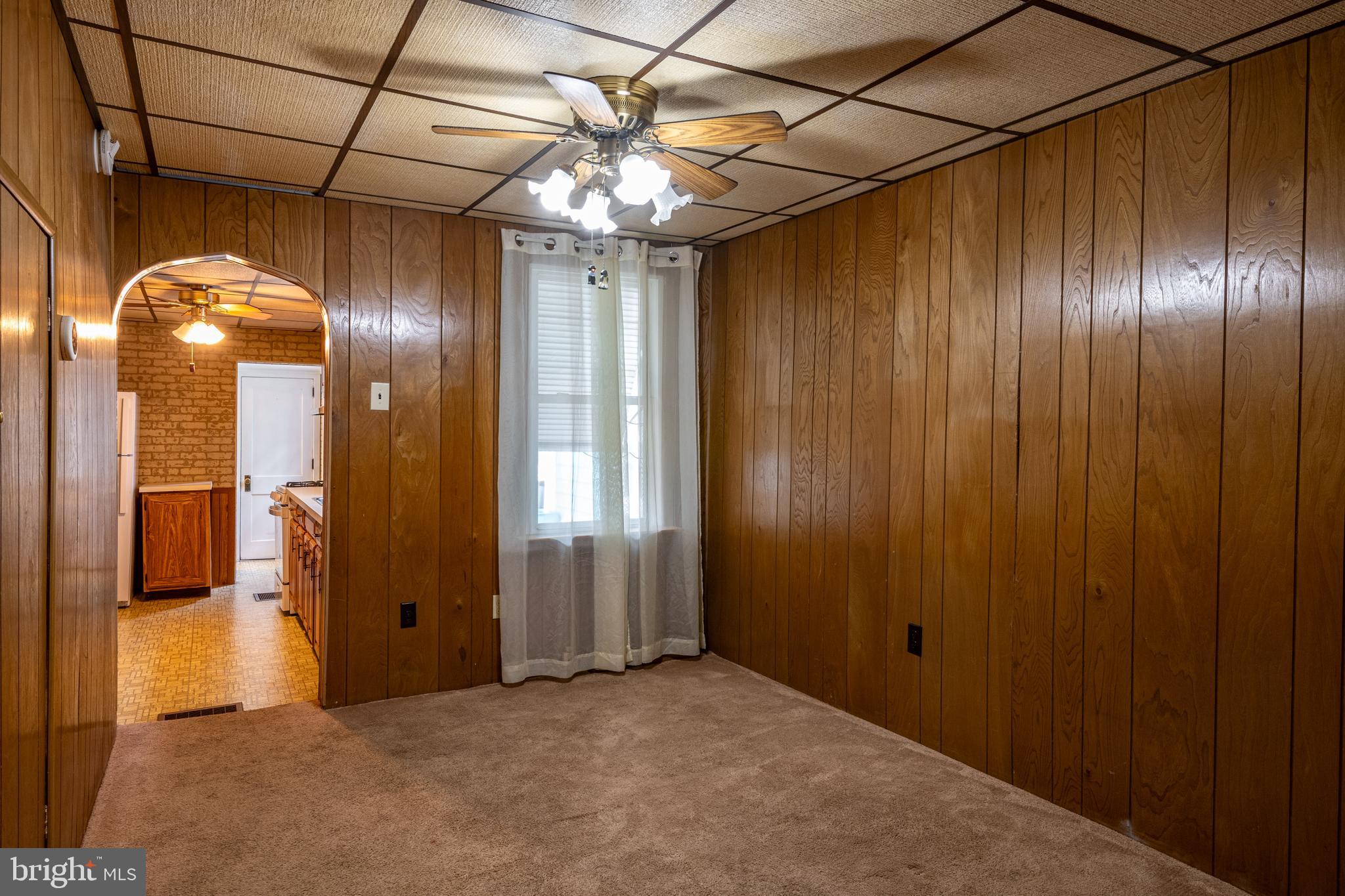 420 North 11th Street Reading, PA 19604 - Photo 7 of 20 a view of a hallway with a chandelier fan and windows