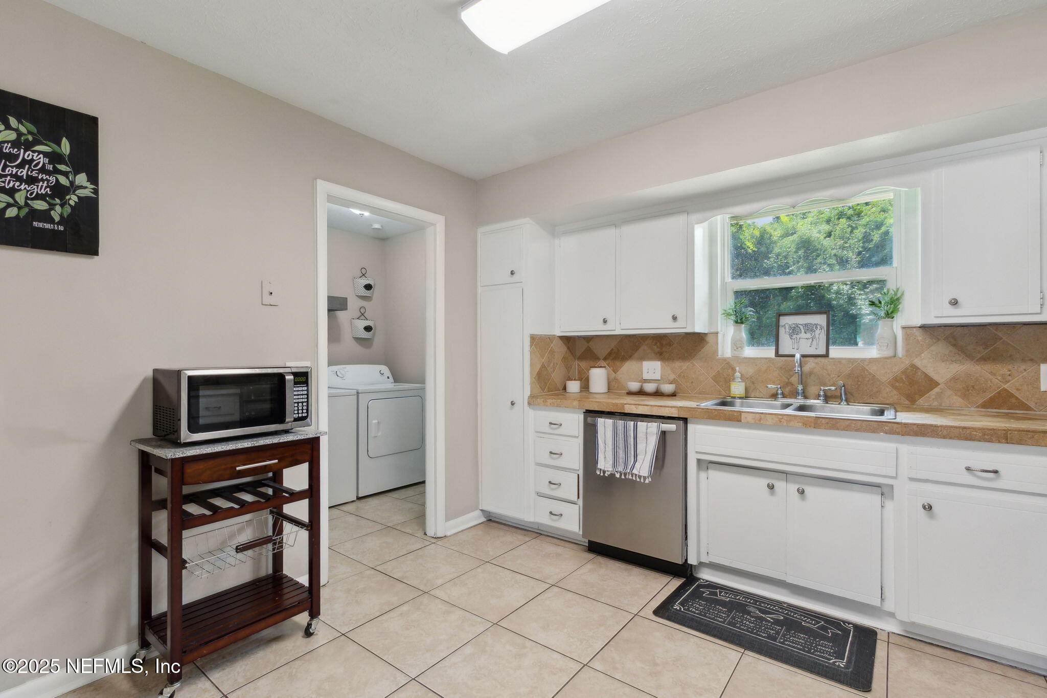 2806 Annette Circle Jacksonville, FL 32216 - Photo 14 of 31 a kitchen with a stove a sink and a refrigerator