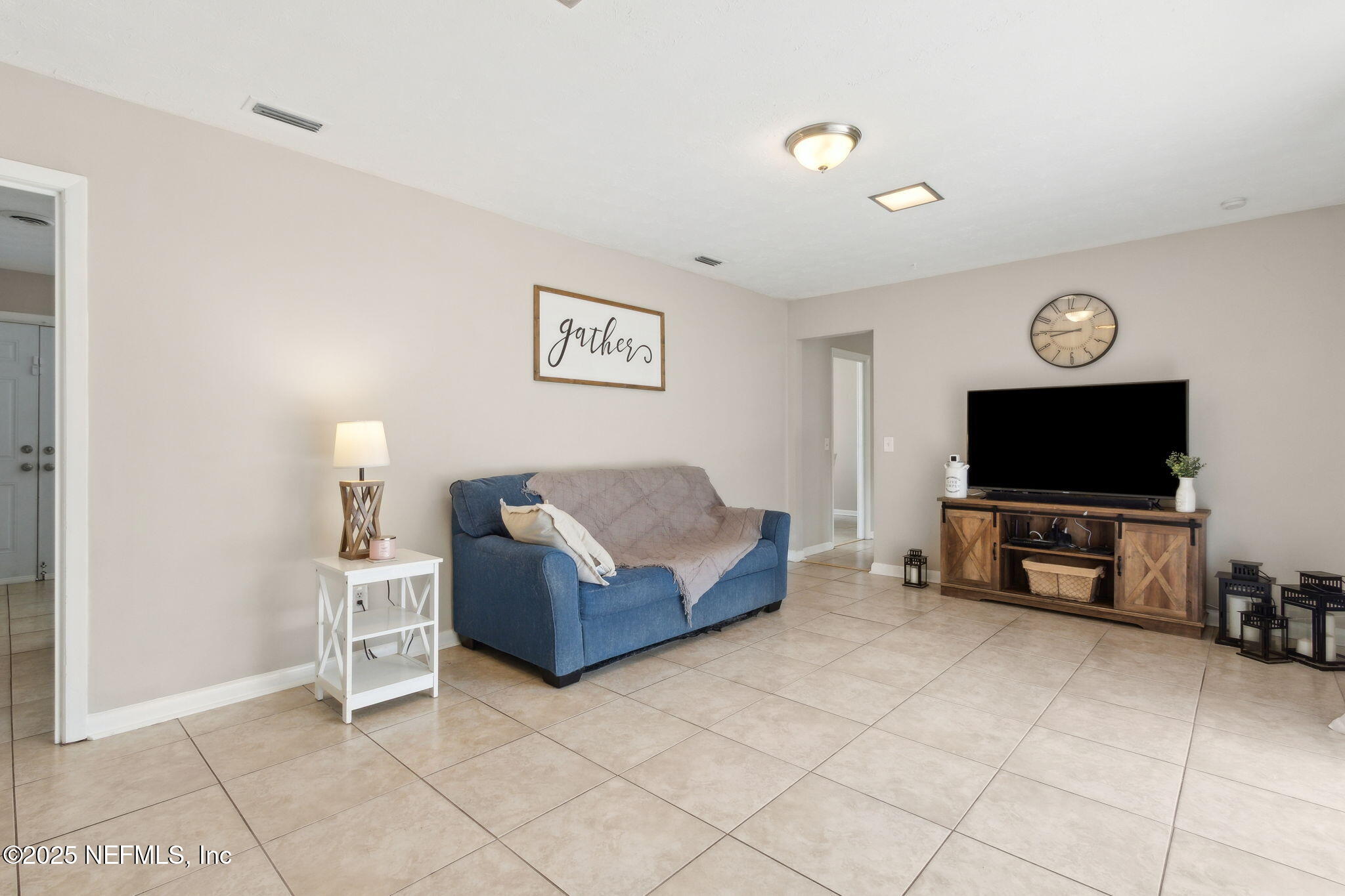 2806 Annette Circle Jacksonville, FL 32216 - Photo 16 of 31 a living room with furniture and a flat screen tv