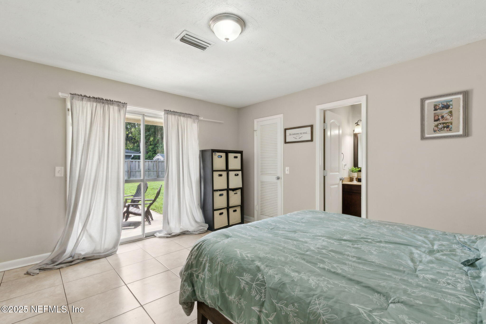 2806 Annette Circle Jacksonville, FL 32216 - Photo 19 of 31 a bedroom with a large bed and a window