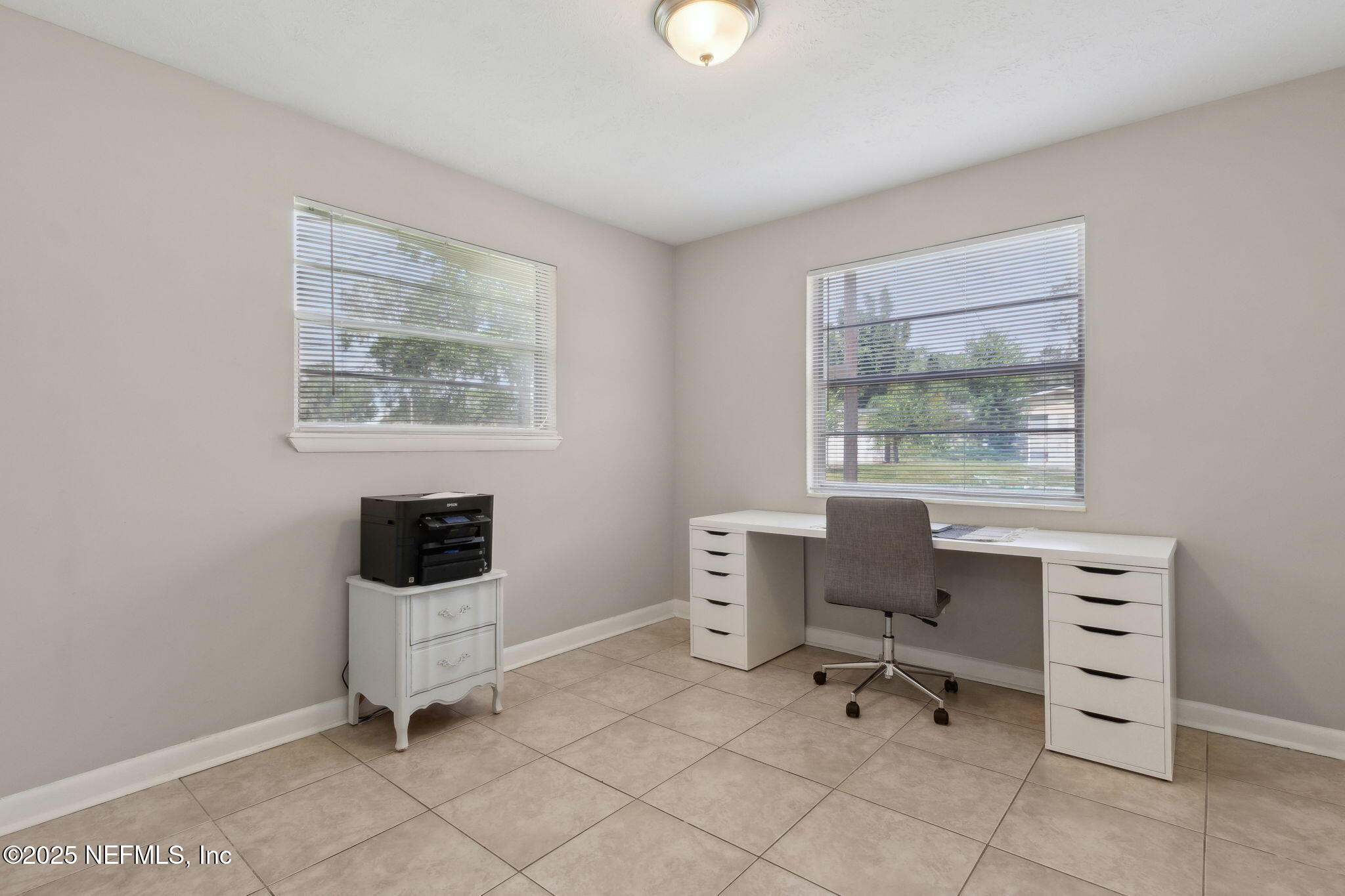 2806 Annette Circle Jacksonville, FL 32216 - Photo 22 of 31 a work room with furniture a lamp and a window