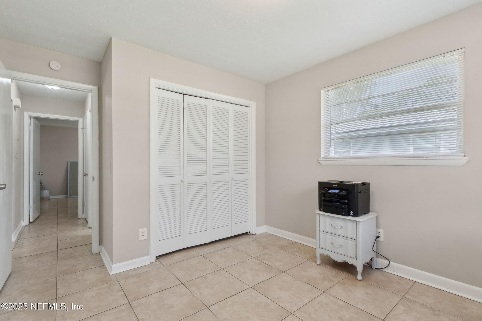 2806 Annette Circle Jacksonville, FL 32216 - Photo 23 of 31 a view of room with window and a ceiling fan